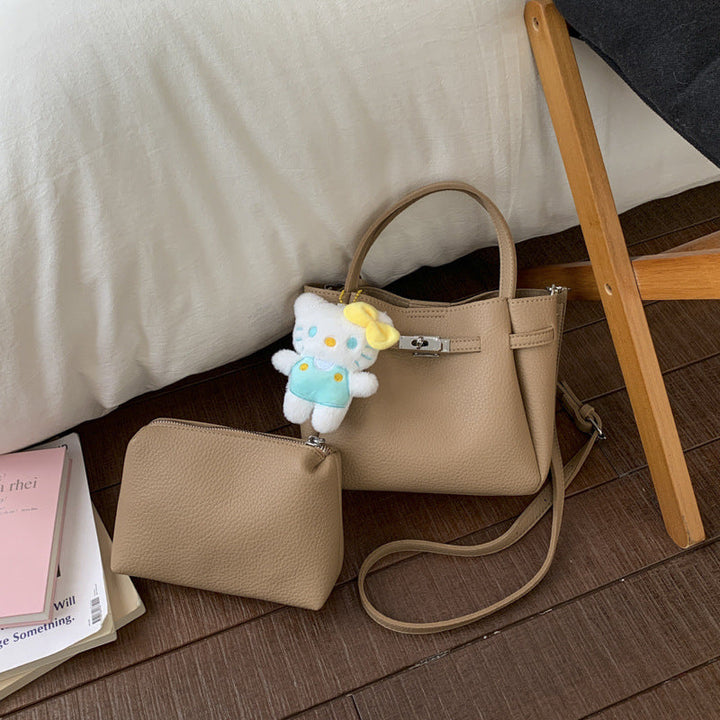 Ladies mini handbag with detachable cosmetic pouch