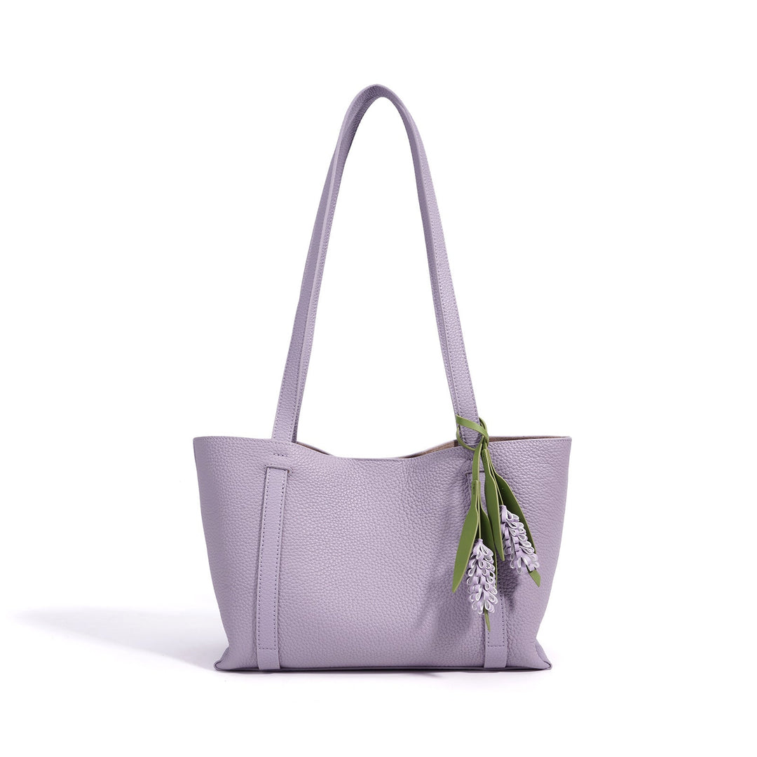 Ladies stylish tote bag with floral pendant