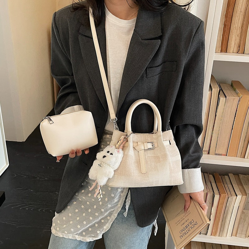 Women’s mini handbag with modern accents and practical interior organizer