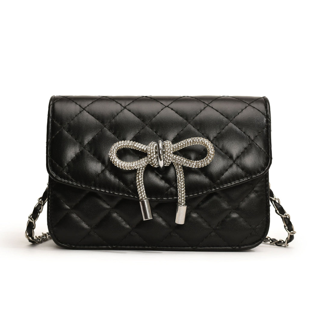 Ladies mini handbag with luxurious quilted pattern and sparkling chain pendant