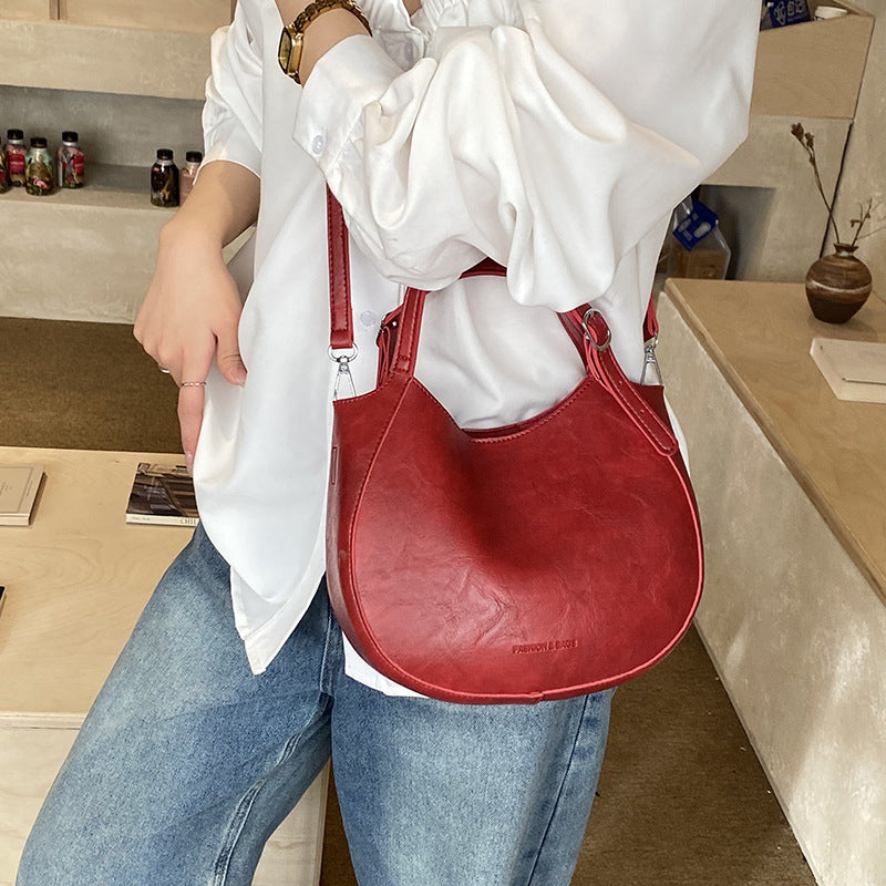 Women's shoulder bag made of high-quality artificial leather with fashionable trim