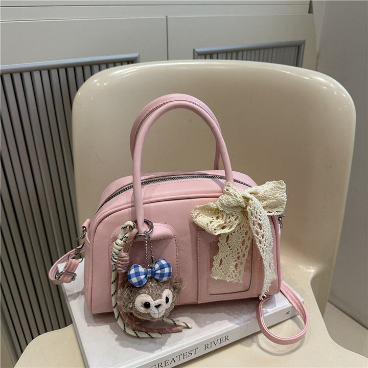 Ladies Mini Handbag with playful animal motif and charming charm