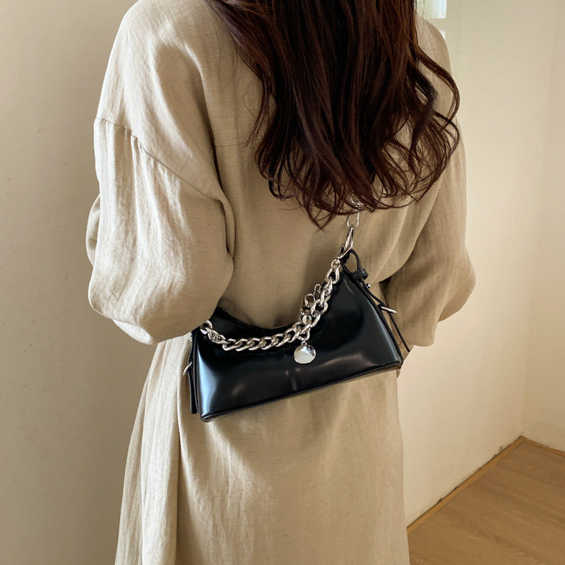 Women's fashionable shoulder bag with sparkling chain accent