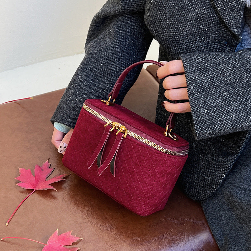 Women's structured shoulder bag with detachable carrying strap