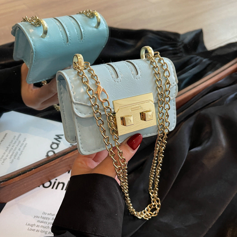 Women's mini handbag with elegant metal accents