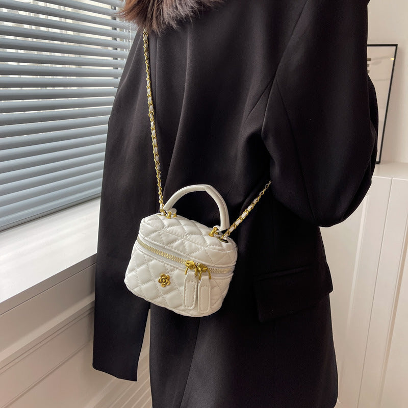 Women's mini bag in elegant quilted design with golden accents