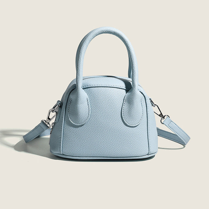 Women's mini handbag with structured exterior and detachable shoulder strap