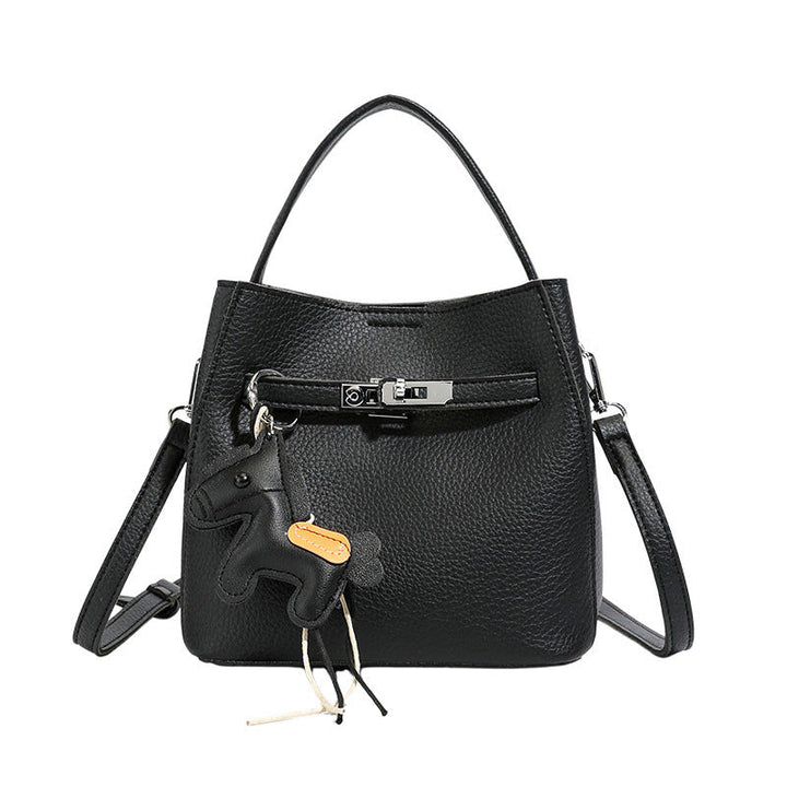 Women’s mini crossbody bag with playful design and cute charm