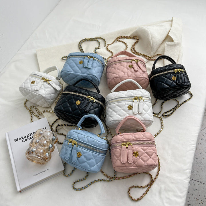 Women's mini bag in elegant quilted design with golden accents