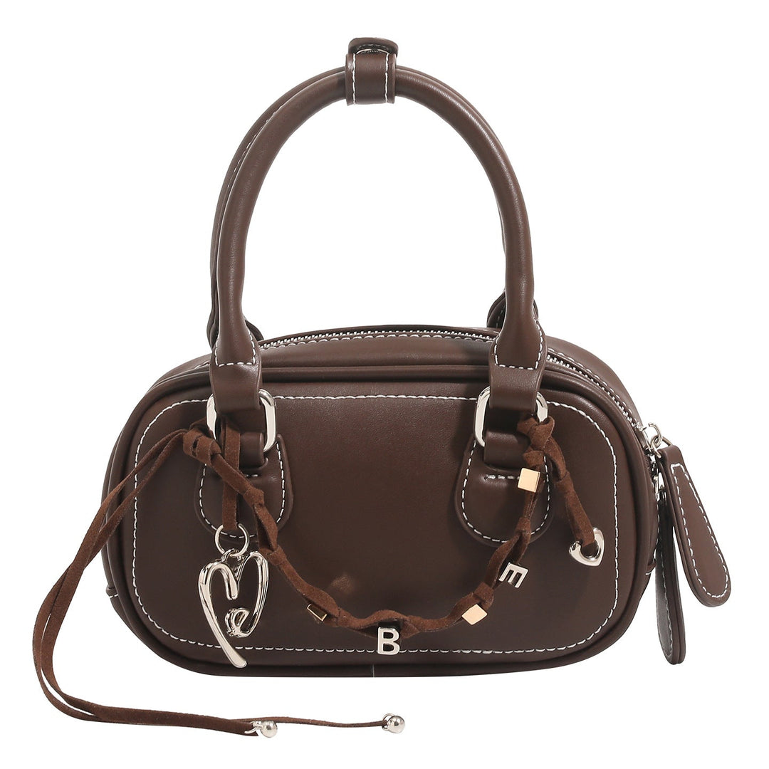 Women's mini handbag with playful drawstring and elegant accents