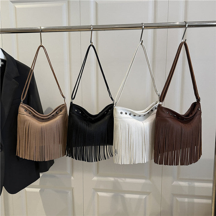 Ladies shoulder bag with fringes and studs