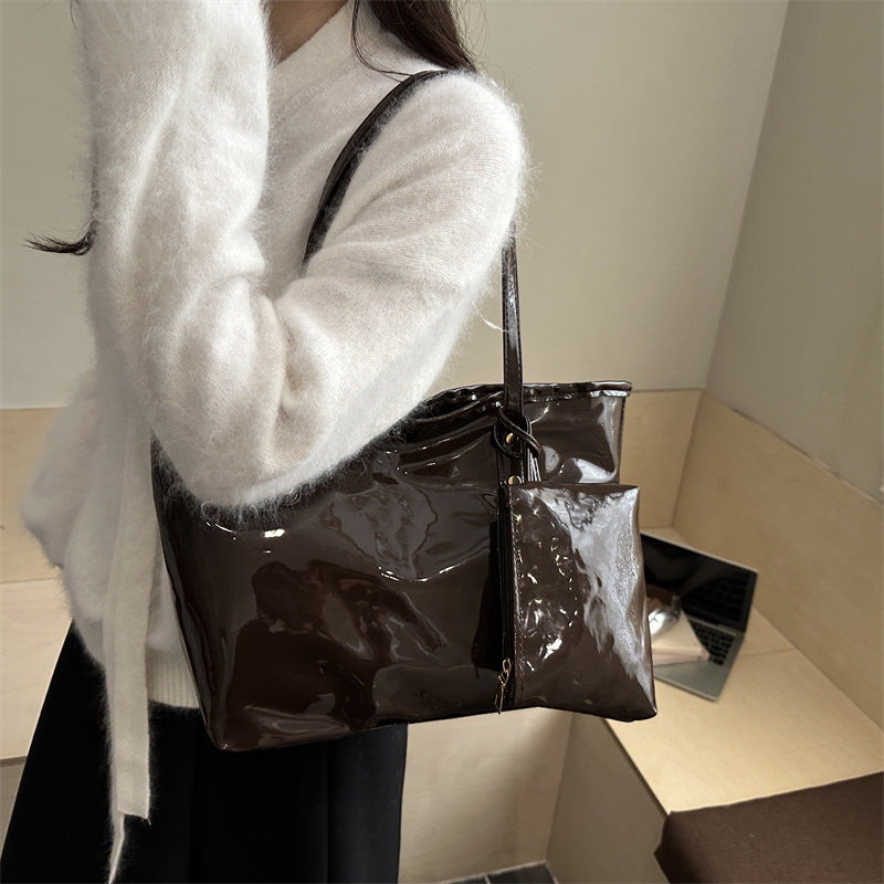 Women's elegant patent leather tote with removable interior compartment
