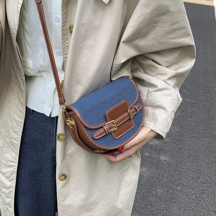 Women’s shoulder bag made of durable denim with leather accents