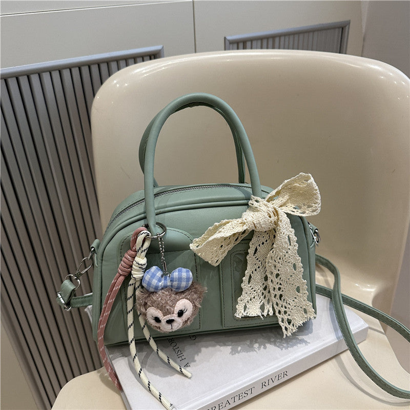 Ladies Mini Handbag with playful animal motif and charming charm