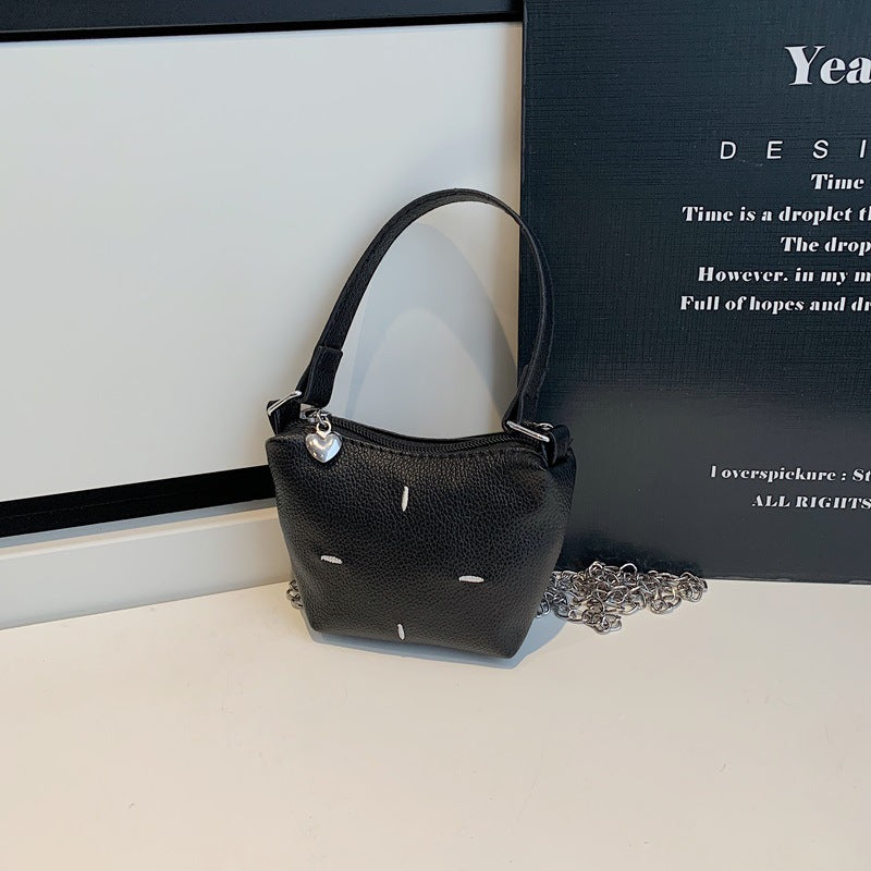 Women's mini handbag with shiny chain and textured upper material