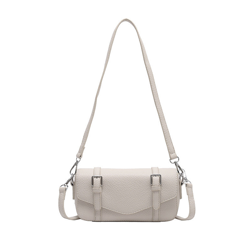 Women's elegant shoulder bag made of textured synthetic leather with adjustable shoulder strap