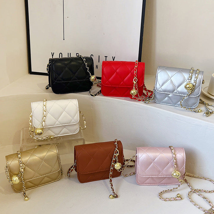 Women's mini crossbody bag with shiny chain and charming pendant