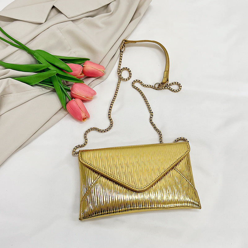 Women's elegant clutch with shiny upper material