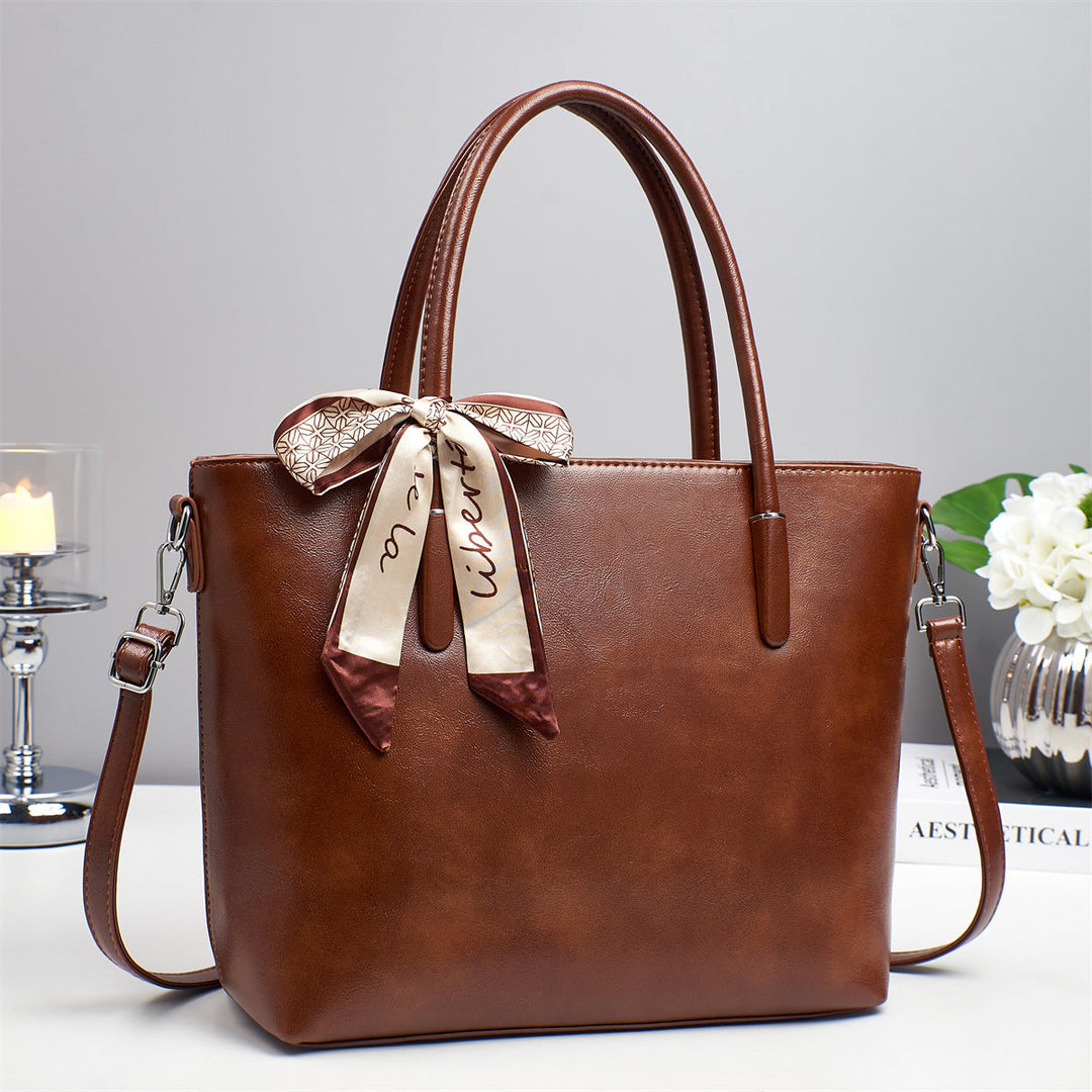 Women's elegant shoulder bag with playful bow accent