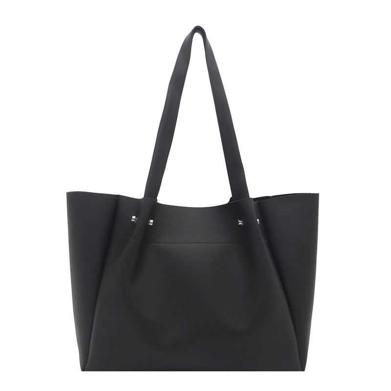 Women's tote bag with elegant minimalist structure and sturdy carrying handles