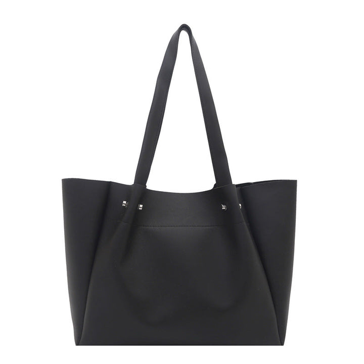 Women's tote bag with elegant minimalist structure and sturdy carrying handles