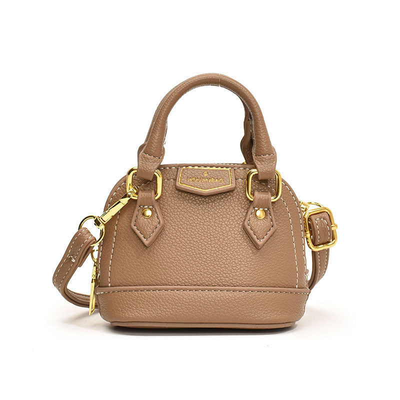 Women’s mini hobo bag made of textured synthetic leather with golden accents
