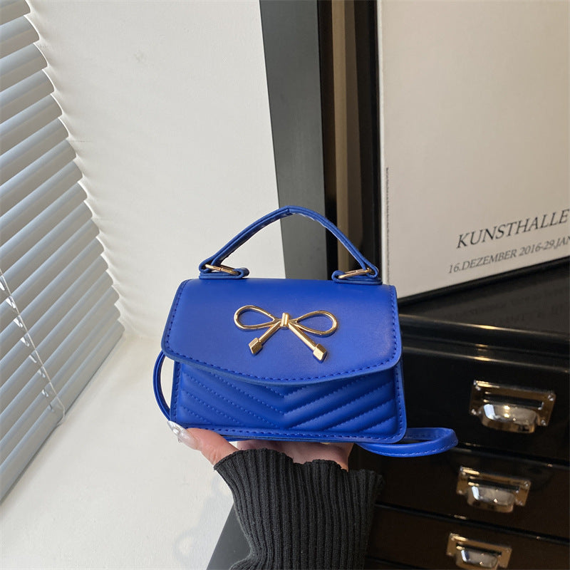 Women’s mini handbag with elegant bow decoration