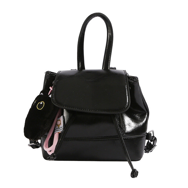 Women's mini backpack with playful pendant