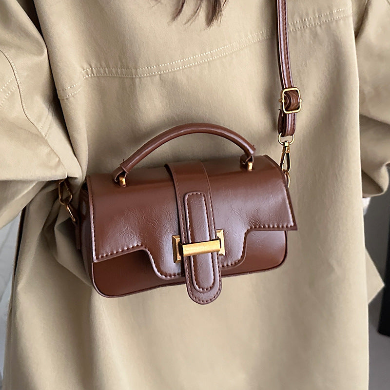 Ladies elegant mini handbag with practical carrying handle and removable shoulder strap