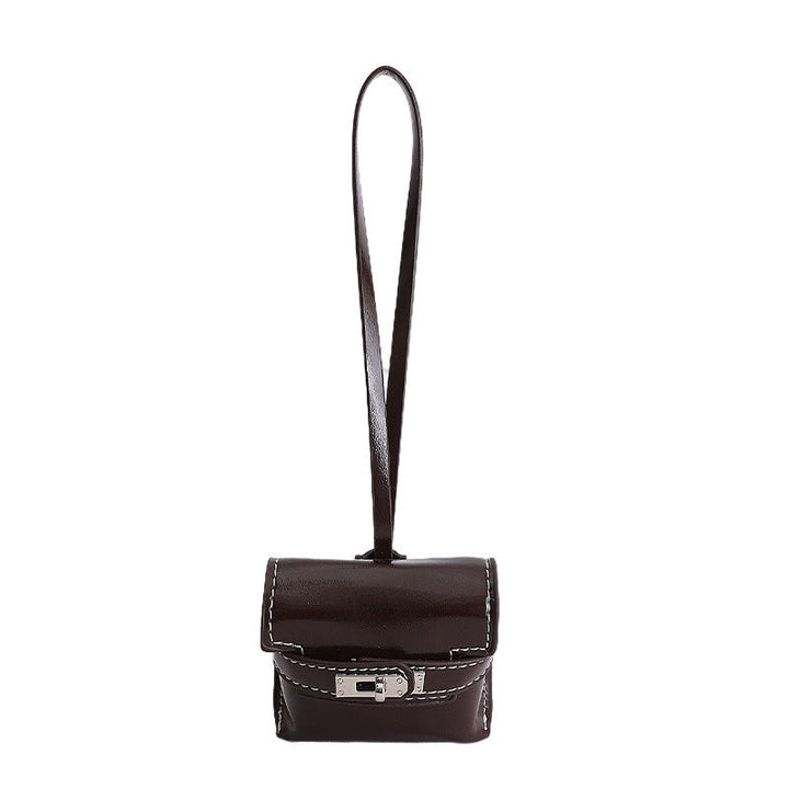 Ladies mini handbag made of high-quality artificial leather with playful closure