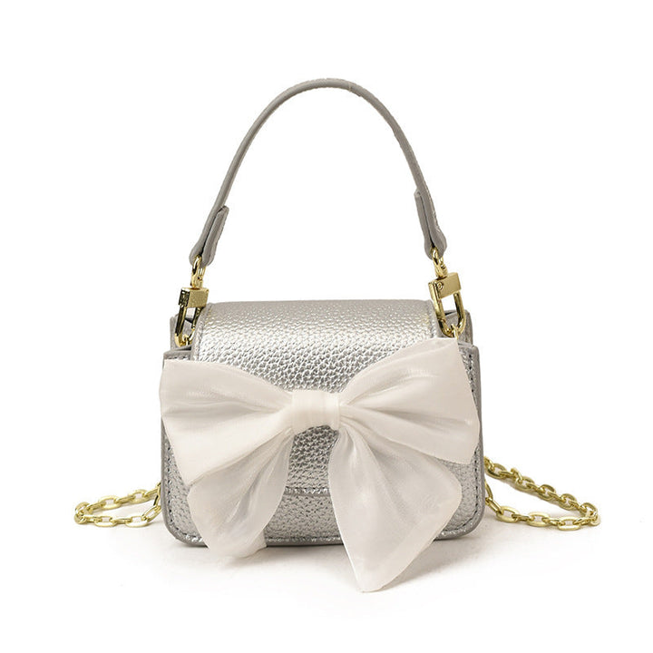 Ladies mini handbag with decorative bow design