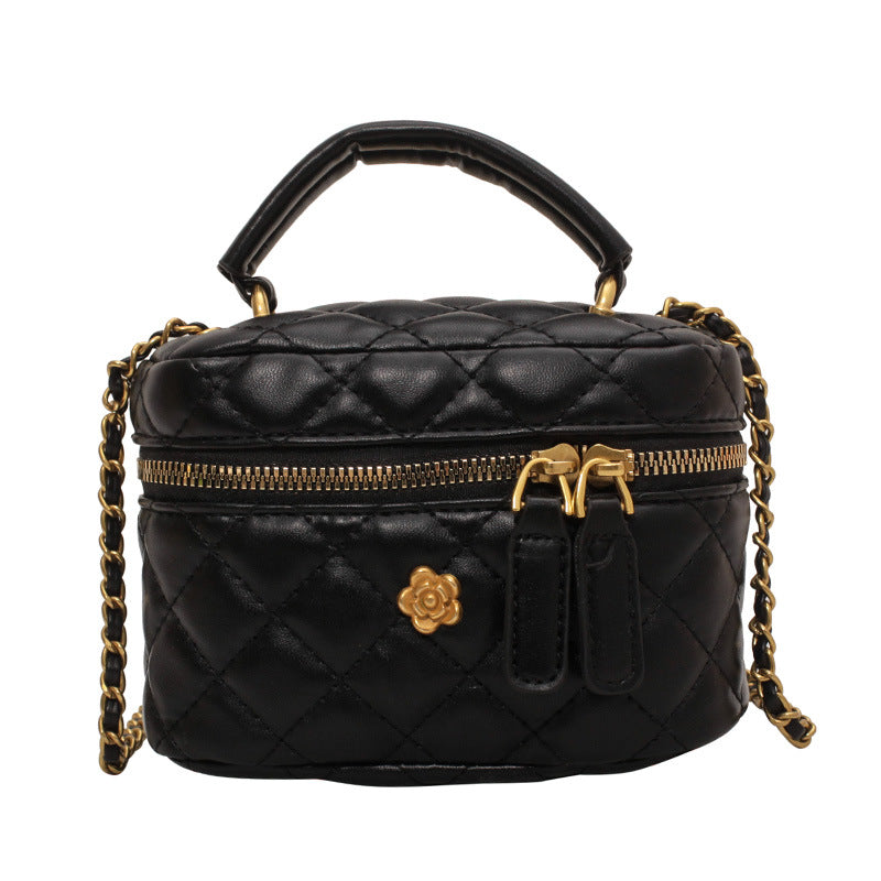 Women's mini bag in elegant quilted design with golden accents