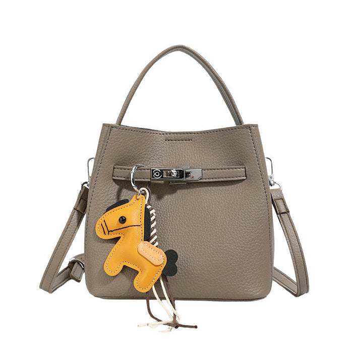 Women’s mini crossbody bag with playful design and cute charm
