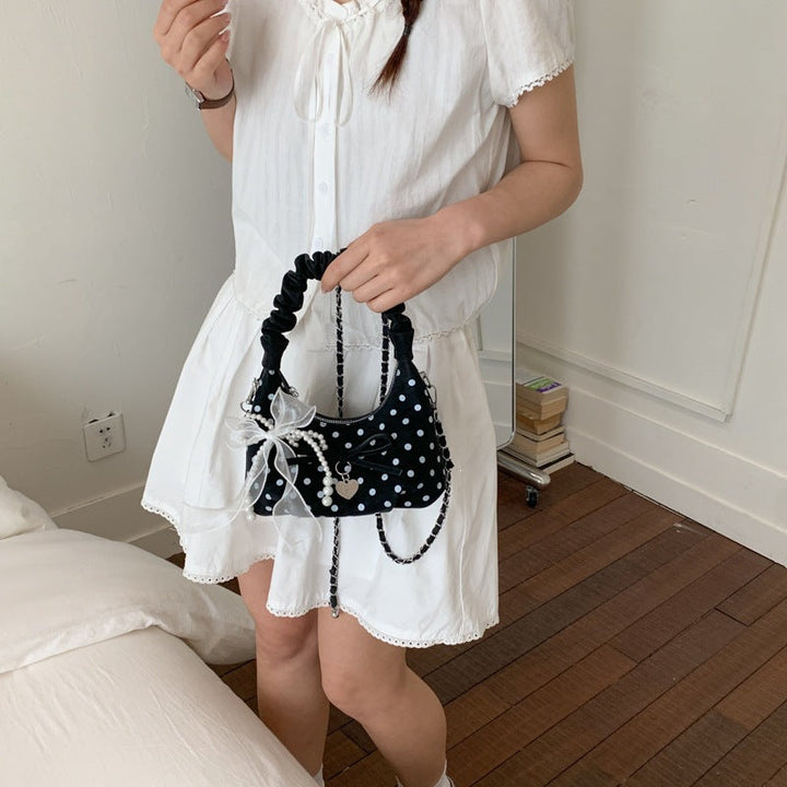 Women's mini handbag with decorative accents