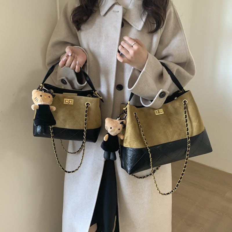 Women's shoulder bag with elegant chain accent and cute pendant