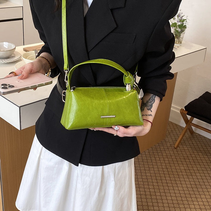 Ladies elegant handbag with minimalist design and noble accents