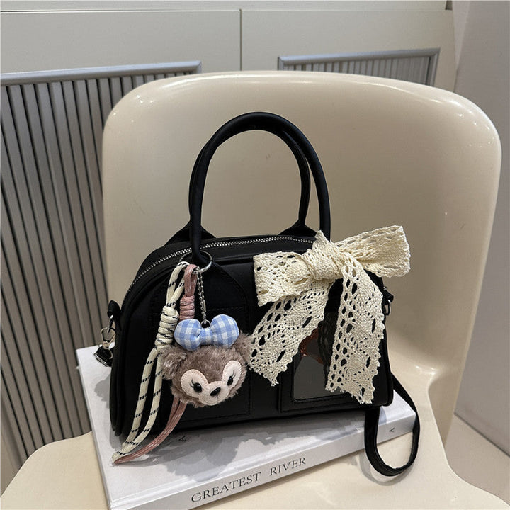 Ladies Mini Handbag with playful animal motif and charming charm