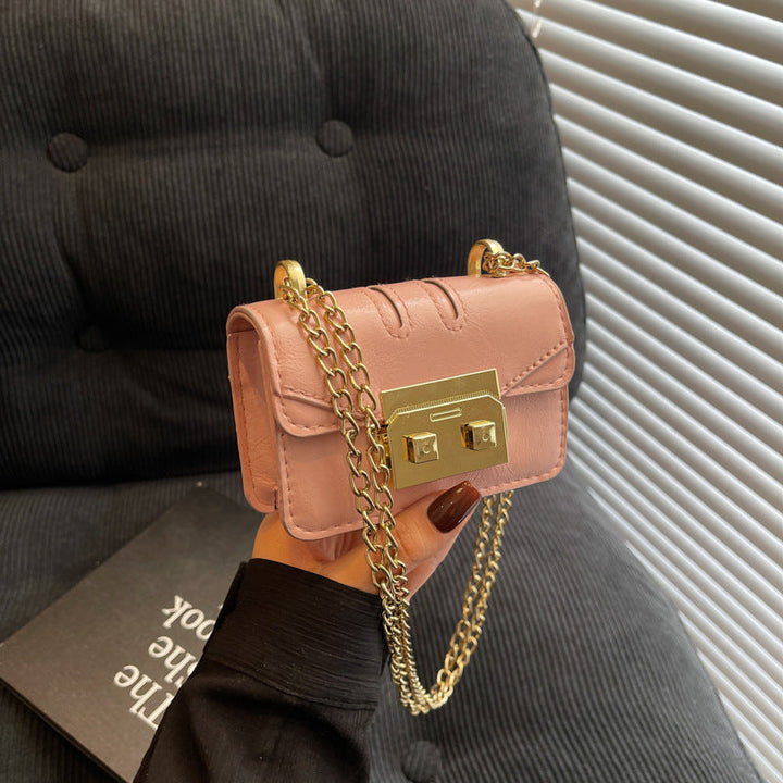 Women's mini handbag with elegant metal accents