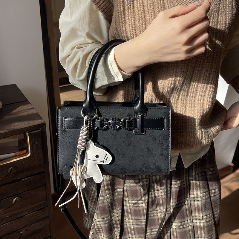 Women's handbag in modern minimalist style with playful charm