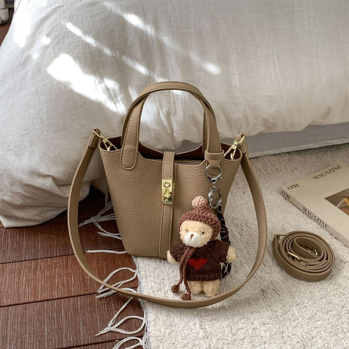 Women's mini handbag with playful animal charm