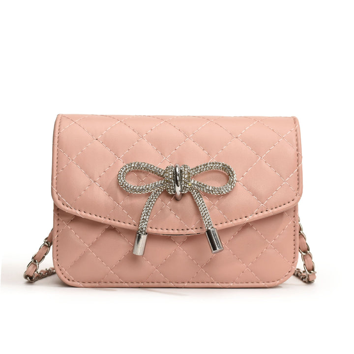 Ladies mini handbag with luxurious quilted pattern and sparkling chain pendant