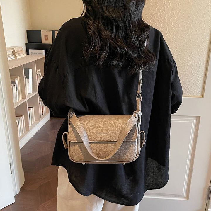 Women’s shoulder bag made of soft, textured leather with adjustable shoulder strap
