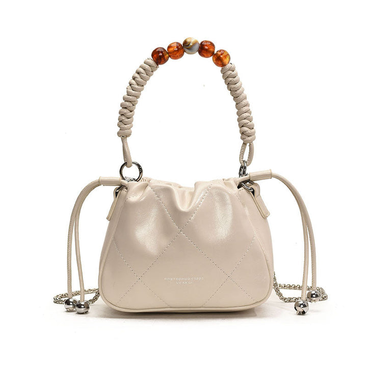Ladies mini shoulder bag with decorative chain strap and trendy charm