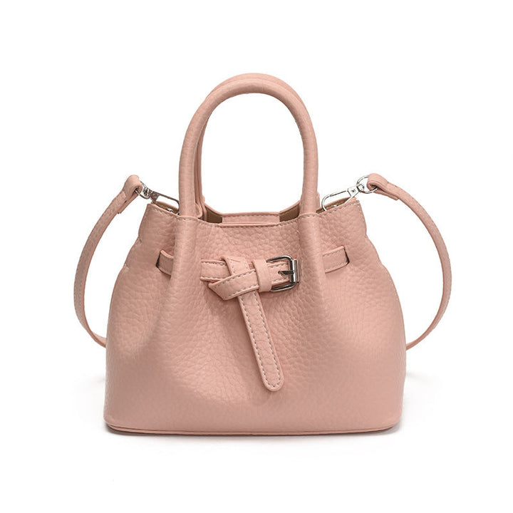 Women's mini handbag with stylish button closure