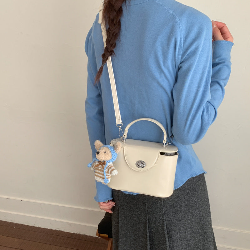 Women’s mini handbag with cute animal pendant