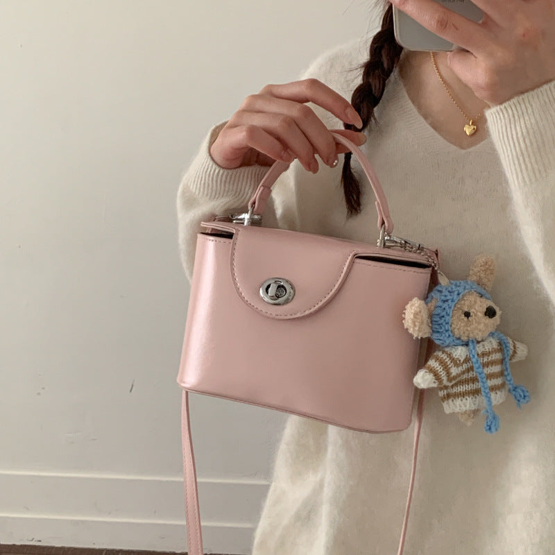 Women’s mini handbag with cute animal pendant