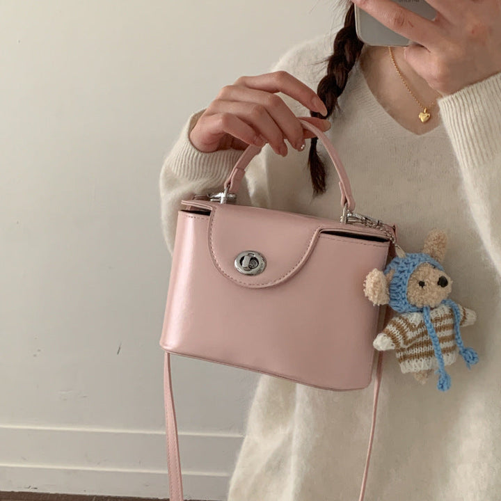 Women’s mini handbag with cute animal pendant