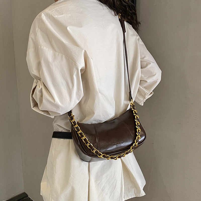 Women's shoulder bag with elegant chain accent