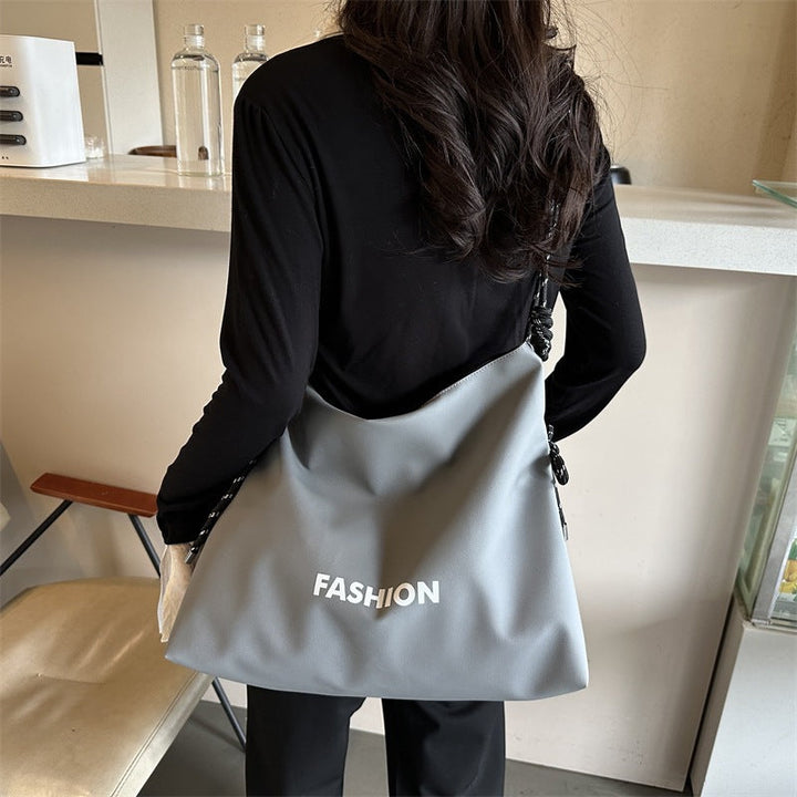 Women's stylish tote bag with braided drawstring
