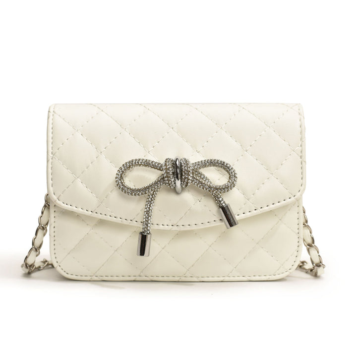 Ladies mini handbag with luxurious quilted pattern and sparkling chain pendant